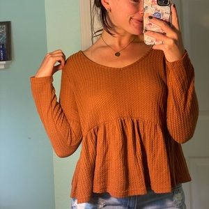 Mermaid style burnt orange shirt.